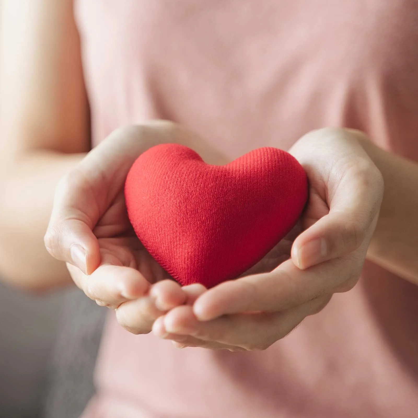 donate-2 Woman holding out a heart